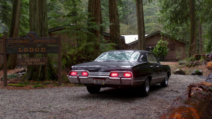 Dean drives up to the empty lodge.